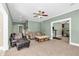 Large living room offering easy access to the adjacent kitchen and a cozy seating area at 1604 Summersweet Ln, Dacula, GA 30019