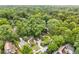 Aerial view of a neighborhood with mature trees and well-maintained homes at 228 Clarion Ave, Decatur, GA 30030