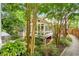 Landscaped backyard view showcasing a sunroom and lush greenery at 228 Clarion Ave, Decatur, GA 30030