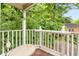 Balcony area overlooking a lush, wooded backyard at 228 Clarion Ave, Decatur, GA 30030