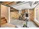 Basement with exposed ceiling and stone wall, and workout equipment at 228 Clarion Ave, Decatur, GA 30030