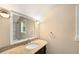 Bathroom featuring granite counters, updated fixtures, and natural light at 228 Clarion Ave, Decatur, GA 30030