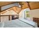 Comfortable bedroom with vaulted ceiling, fan, and natural light at 228 Clarion Ave, Decatur, GA 30030