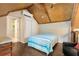 Cozy bedroom with hardwood floors and exposed beam ceiling at 228 Clarion Ave, Decatur, GA 30030