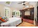 Vaulted ceiling bedroom with built-in cabinets and backyard view at 228 Clarion Ave, Decatur, GA 30030