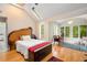 Bright bedroom with skylight, hardwood floors, and outdoor access at 228 Clarion Ave, Decatur, GA 30030