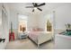 Cozy bedroom with a ceiling fan, natural light, and neutral decor at 228 Clarion Ave, Decatur, GA 30030