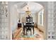 Cozy dining room with hardwood floors, chandelier and large windows that create an inviting atmosphere at 228 Clarion Ave, Decatur, GA 30030