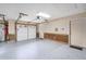 Spacious garage with epoxy floor, storage, and access door offers convenience and functionality at 228 Clarion Ave, Decatur, GA 30030