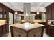 Spacious kitchen island with custom mosaic tiling and granite countertops, perfect for entertaining at 228 Clarion Ave, Decatur, GA 30030