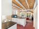 Bright kitchen featuring white cabinetry, mosaic backsplash, and unique wood-paneled ceiling at 228 Clarion Ave, Decatur, GA 30030