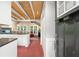 Open kitchen with stainless appliances, granite countertops, and tile floors at 228 Clarion Ave, Decatur, GA 30030
