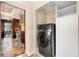 Modern front load washer and dryer with custom built-in shelving unit at 228 Clarion Ave, Decatur, GA 30030