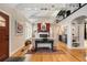 Living room with wood floors, fireplace and large windows bringing in natural light at 228 Clarion Ave, Decatur, GA 30030