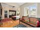 Spacious main bedroom features a seating area and custom closet system at 228 Clarion Ave, Decatur, GA 30030
