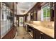 Butler's pantry featuring granite counters, wood cabinets, tile floors and large shelving at 228 Clarion Ave, Decatur, GA 30030