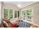 Bright sunroom with large windows and peaceful outdoor view at 228 Clarion Ave, Decatur, GA 30030
