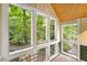Bright sunroom with large windows offering serene outdoor views at 228 Clarion Ave, Decatur, GA 30030