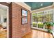 Bright sunroom with brick accents and large windows for natural light at 228 Clarion Ave, Decatur, GA 30030