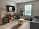 Spacious playroom featuring a large tv, plenty of toys and comfortable places to sit at 30 Sloane Ct, Covington, GA 30016