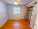 Bedroom with hardwood floors, fan and window with blinds at 3082 Dove Way, Decatur, GA 30033