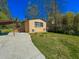 Exterior view of a home featuring covered parking and a well maintained lawn at 3082 Dove Way, Decatur, GA 30033