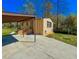 Home featuring covered parking area and well maintained lawn at 3082 Dove Way, Decatur, GA 30033