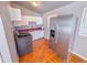 Kitchen featuring stainless steel appliances, tiled floor, and white cabinets at 3082 Dove Way, Decatur, GA 30033