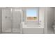 Bathroom features separate tub and shower at 3910 Near Star Ln, Cumming, GA 30028