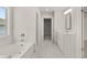 Bathroom with tub and walk through to walk in closet at 3910 Near Star Ln, Cumming, GA 30028