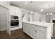 Spacious kitchen with an island, stainless steel appliances, and white cabinets, perfect for cooking and entertaining at 3910 Near Star Ln, Cumming, GA 30028