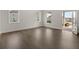 Inviting living room with hardwood floors, neutral walls, and a bright open doorway, offering a seamless flow at 3910 Near Star Ln, Cumming, GA 30028