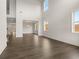 Spacious living room boasting soaring ceilings, hardwood floors, and an abundance of natural light from large windows at 3910 Near Star Ln, Cumming, GA 30028