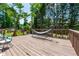 Relaxing back deck with a hammock and wooded views, perfect for outdoor enjoyment at 1130 S Rudder Rd, Cumming, GA 30041