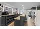 Finished basement boasts a bar with butcher block counters, built-in shelving, and an adjacent living space at 1130 S Rudder Rd, Cumming, GA 30041
