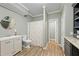 Well-lit bathroom featuring a modern vanity, toilet, and shower-tub combination at 1130 S Rudder Rd, Cumming, GA 30041