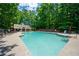Large community pool with lounge chairs and umbrellas, perfect for summer relaxation at 1130 S Rudder Rd, Cumming, GA 30041