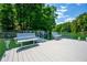 Lakefront dock with built-in bench seating and fishing platform provides the perfect spot to unwind and enjoy the outdoors at 1130 S Rudder Rd, Cumming, GA 30041