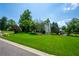 Side view of a beautiful house sitting on a sprawling lush green lawn at 1130 S Rudder Rd, Cumming, GA 30041