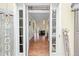 Welcoming front entryway showcasing hardwood floors leading to a living area at 1130 S Rudder Rd, Cumming, GA 30041