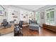 Cozy home office with built-in bookshelves and comfortable seating at 1130 S Rudder Rd, Cumming, GA 30041