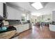 Spacious kitchen with an open-concept layout to the dining area, white cabinets, and granite countertops at 1130 S Rudder Rd, Cumming, GA 30041