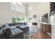 Comfortable living room with fireplace and large windows at 1130 S Rudder Rd, Cumming, GA 30041