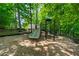 Community playground with slides, climbing structure, and wood chip ground cover at 1130 S Rudder Rd, Cumming, GA 30041