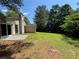 The backyard is a nice green lawn and has lots of trees around at 120 Squirrel Way, Atlanta, GA 30349