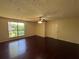 Bright bedroom featuring hardwood floors and a large window at 120 Squirrel Way, Atlanta, GA 30349