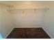 Walk-in closet space offering ample storage with built-in shelving and neutral carpeting at 120 Squirrel Way, Atlanta, GA 30349