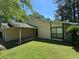 Cozy home with a covered entrance and well-maintained lawn at 120 Squirrel Way, Atlanta, GA 30349