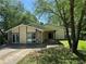 Charming one-story home featuring stone accents and mature trees at 120 Squirrel Way, Atlanta, GA 30349