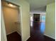 Hallway featuring a bar area with granite countertop and easy access to the living room at 120 Squirrel Way, Atlanta, GA 30349